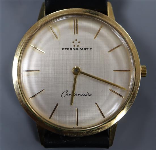 A gentlemans gold plated Eterna Matic Centenaire manual wind wrist watch, on later associated strap.